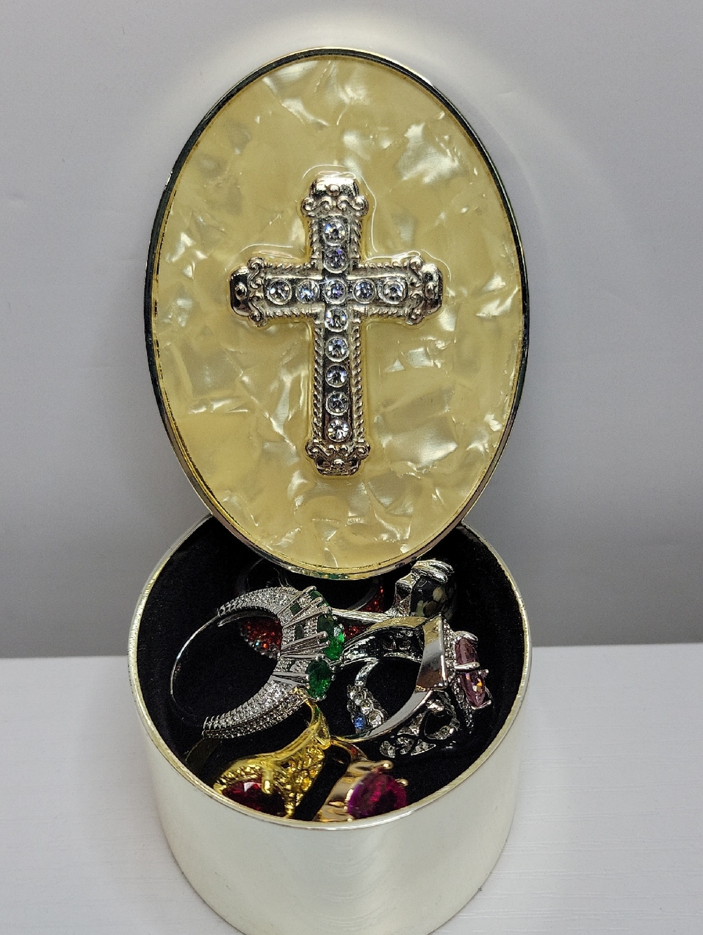 Oval Jewelry Box with Jeweled Cross Lid Filled With Sz8 Rings